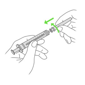 464.Hands connecting needle to syringe